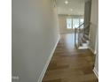 Inviting entryway with wood flooring and staircase leading to the upper level at 409 Marthas View Way, Wake Forest, NC 27587