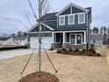 Charming two-story home with landscaped front yard at 409 Marthas View Way, Wake Forest, NC 27587