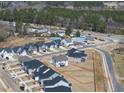 Aerial view of the neighborhood featuring a community pool, and mature trees at 77 Buckhorn Branch Park # 174, Clayton, NC 27520