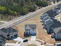 An aerial view of the property shows lot boundaries and surrounding homes in a residential area at 77 Buckhorn Branch Park # 174, Clayton, NC 27520