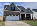 Inviting brick home with a two-car garage, a covered front porch and gabled roofline at 1060 Fairhaven Dr # 96, Mebane, NC 27302