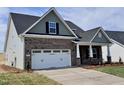 Attractive home featuring a two-car garage, covered entry, and well-maintained landscaping at 1060 Fairhaven Dr # 96, Mebane, NC 27302