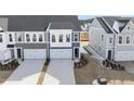 Three-unit townhome building with attached garages and landscaping at 20 Nettle Ln # 239, Clayton, NC 27520