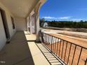 View from the porch of the community showcasing level lots, green trees and clear blue skies at 6040 Scalybark Road, Durham, NC 27712