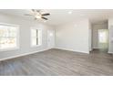 Spacious living room showcasing wood-look floors, white trim, and plenty of natural light at 127 Tupelo Dr, Spring Hope, NC 27882