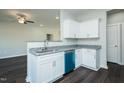 Modern kitchen with granite counters, stainless steel sink and blue dishwasher at 286 Yellowwood Ave, Spring Hope, NC 27882