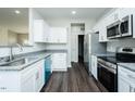 Well-lit kitchen with stainless appliances, granite countertops, and sleek cabinetry at 286 Yellowwood Ave, Spring Hope, NC 27882