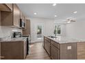 Modern kitchen with granite countertops, stainless steel appliances, and island at 809 Pryor St, Mebane, NC 27302