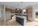 Modern kitchen with granite countertops, island, and stainless steel appliances at 145 Brookhaven Dr, Spring Hope, NC 27882