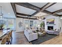 Spacious living room with hardwood floors, fireplace, and exposed wooden beams at 149 Brandy Ml, Pittsboro, NC 27312