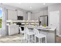 Eat in kitchen with island and stainless steel appliances, perfect for cooking and entertaining at 609 Chopper Ln # Homesite 10, Durham, NC 27703