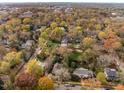 Expansive aerial view showcases the neighborhood with beautiful mature trees and a serene atmosphere at 205 N Boundary St, Chapel Hill, NC 27514