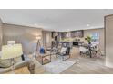 Open-concept living space with a kitchen, dining area, and comfortable seating with natural light and modern decor at 1235 Schloss Rd, Louisburg, NC 27549