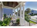 Covered porch with rocking chairs and a water feature at 1509 Heritage Reserve Ct, Wake Forest, NC 27587