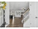Inviting foyer with hardwood floors seamlessly connecting to the open-concept kitchen and living area at 232 Big Barn Dr, Wendell, NC 27591
