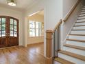 Elegant foyer features hardwood floors, a staircase, and a double-door entry at 2502 St Marys St, Raleigh, NC 27609