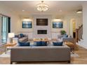 Cozy living room with a modern fireplace, built-in cabinets, and ample seating at 2502 St Marys St, Raleigh, NC 27609