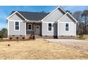 Traditional-style home featuring gray siding, white trim, and a well-manicured front yard, enhancing its curb appeal at 9618 Stallings Rd, Spring Hope, NC 27882