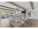 Bright living room with a fireplace, modern furniture, neutral color palette, wood-look floors, and an outdoor balcony at 10529 Pleasant Branch Dr # 201, Raleigh, NC 27614