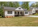 Inviting one-story home with black accents and a neatly kept lawn, perfect for curb appeal at 200 Rawhide Dr, Louisburg, NC 27549
