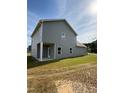 Rear view of the house showing a covered patio and siding at 178 Vili Dr, Broadway, NC 27505
