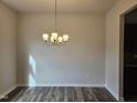 Dining room has stylish light fixture, hardwood flooring and neutral paint, perfect for entertaining at 178 Vili Dr, Broadway, NC 27505
