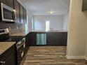 Well-equipped kitchen with stainless steel appliances, granite countertops, and ample cabinet space at 178 Vili Dr, Broadway, NC 27505