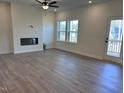 Spacious living room with hardwood floors, recessed lighting, and a cozy fireplace at 7139 Hubner Pl # 30, Cary, NC 27519