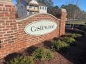An inviting brick sign welcomes residents to the Castlewood community with manicured landscaping at 113 Arundel Dr, Archer Lodge, NC 27527