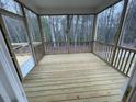 Covered and screened outdoor living area offering a relaxing retreat, and views of the backyard at 113 Arundel Dr, Archer Lodge, NC 27527