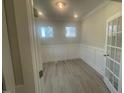 Cozy office space with wainscoting detail and bright lighting at 116 Arundel Dr, Archer Lodge, NC 27527