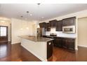 Spacious kitchen with an island and stainless steel appliances at 219 Rosedale Creek Dr, Durham, NC 27703