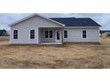 New home with covered patio and grassy backyard at 5890 Old Smithfield Rd, Spring Hope, NC 27882