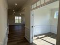 Bright home office features wood floors and wainscoting at 244 Combine Trl # Dm 108, Benson, NC 27504