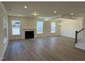 Spacious living room with fireplace and hardwood floors at 244 Combine Trl # Dm 108, Benson, NC 27504