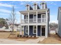 Newly built two-story home with modern siding and a well-maintained front yard at 672 Georgia'S Landing Pkwy # 69, Raleigh, NC 27603