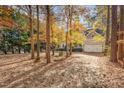 Two-story house surrounded by autumn trees at 1620 Dunn Rd, Raleigh, NC 27614