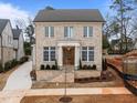Beautiful two-story home boasts a classic brick facade and a well-manicured front yard at 2642 Marchmont St, Raleigh, NC 27608