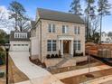 Stunning two-story brick home featuring a prominent front entrance and attached two-car garage at 2642 Marchmont St, Raleigh, NC 27608