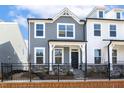 Beautiful two-story home with a fenced front yard and a welcoming entrance at 472 Traditions Grande Blvd # 34, Wake Forest, NC 27587