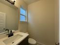 Modern bathroom with a sink, mirror, vanity and a window at 476 Traditions Grande Blvd # 33, Wake Forest, NC 27587