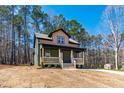 Inviting home with a covered front porch, set among mature trees on a spacious lot at 109 Lone Star Dr, Louisburg, NC 27549