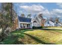 A well maintained lawn surrounds a beautiful house in a treed neighborhood at 170 Carrington Ave, Franklinton, NC 27525