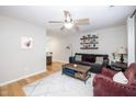 Comfortable living room with a ceiling fan, hardwood floors, and a modern decor at 1320 S State Street # D, Raleigh, NC 27610