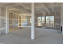 Spacious living room showcasing large windows and an open floor plan ready for customization at 142 Batten Hill Ln, Selma, NC 27576