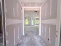 Entryway under construction showing the unfinished interior, natural light, and open floor plan at 1901 Old Bramble Ln # 3, Fuquay Varina, NC 27526