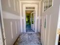 A bright entryway showcasing a door with windows leading to the home's interior during construction at 1901 Old Bramble Ln # 3, Fuquay Varina, NC 27526