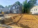 Attractive two-story home featuring gray siding, white trim, and an inviting exterior at 1901 Old Bramble Ln # 3, Fuquay Varina, NC 27526