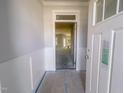 Bright entryway with wainscoting details and an open view to the living spaces, ready for customization at 1901 Old Bramble Ln # 3, Fuquay Varina, NC 27526