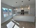 Modern kitchen with granite countertops and stainless steel appliances at 50 Calabria Ct, Franklinton, NC 27525